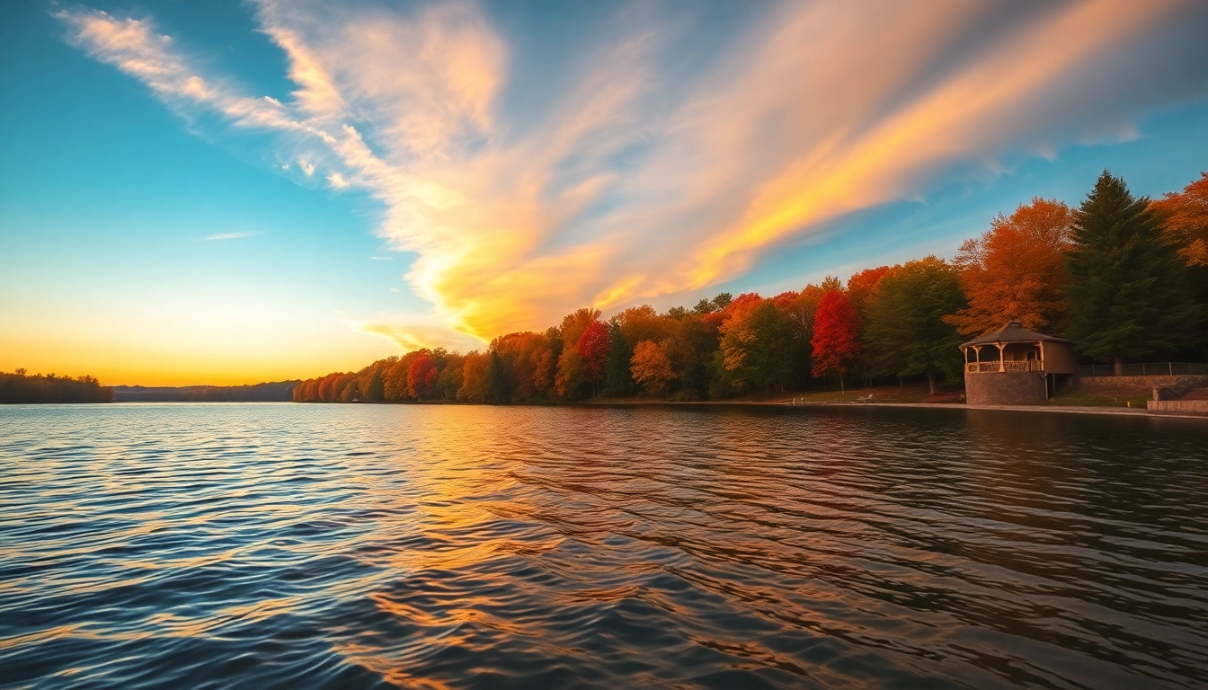 Clarksburg's sunset over a tranquil lake with autumn trees reflecting in the water.